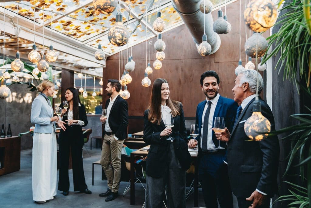 People socializing at a stylish indoor event.